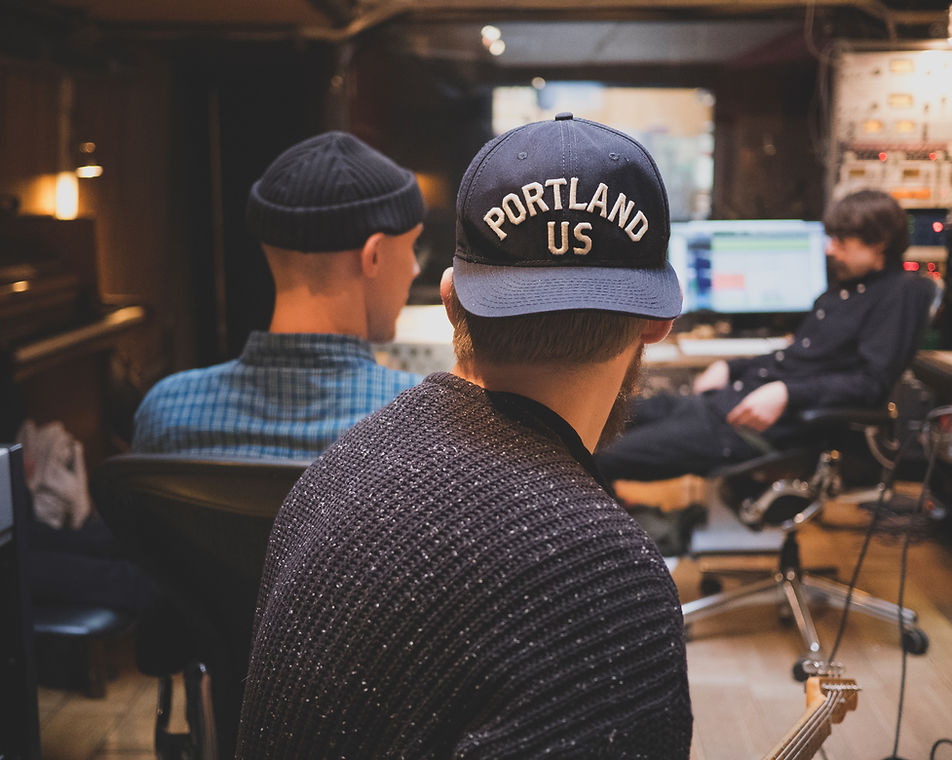 Three men in a studio