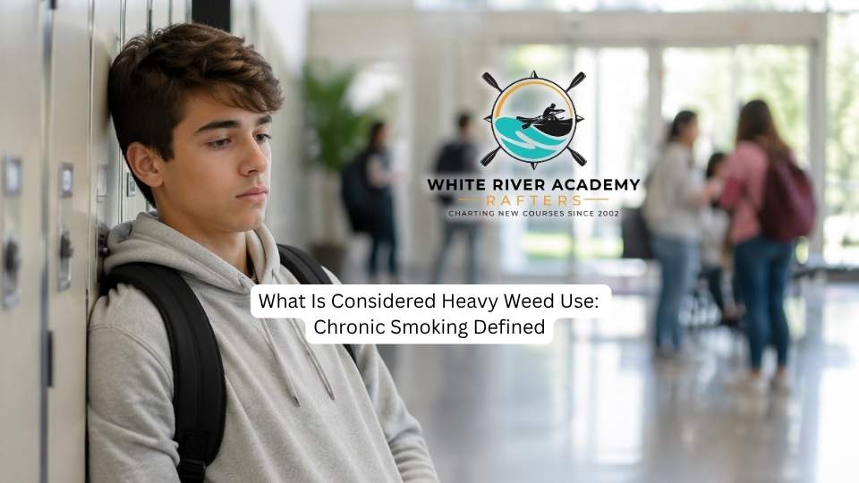What Is Considered Heavy Weed Use Chronic Smoking Defined hero image of a boy standing in a hallway.