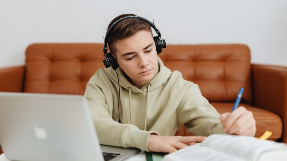 Effects on the Brain From Weed are researched by a boy on his laptop.