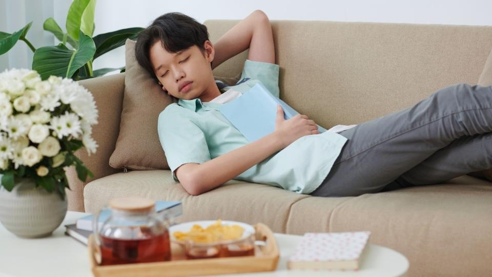 What Is Sherm hero image of a teen boy laying on a couch.