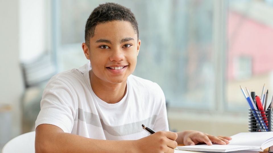 wax with weed hero image of a teen boy sitting at a desk.